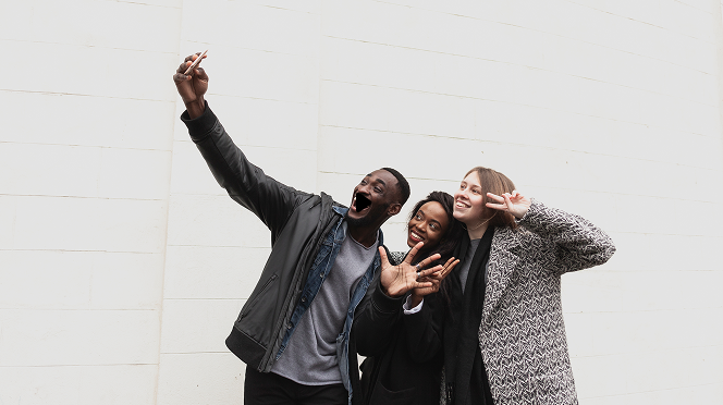 Video thumbnail showing people taking a selfie